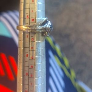 Sterling Silver size 6 3/4 Ring with a blue diamond in the center.